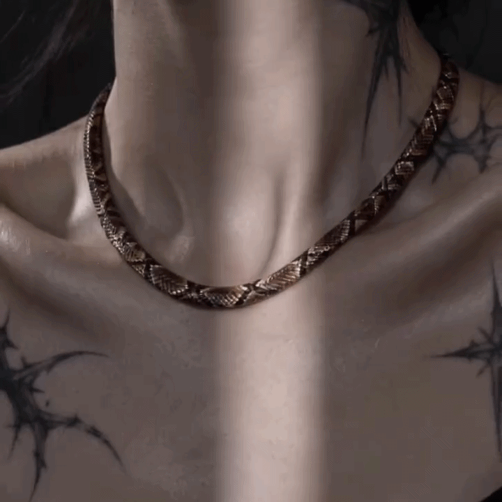 Close-up of a model styling the snake necklace